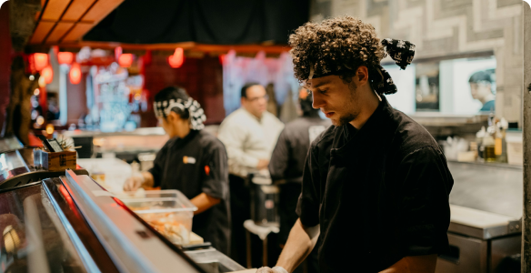 Chefs working the line in a multi-venue restaurant group